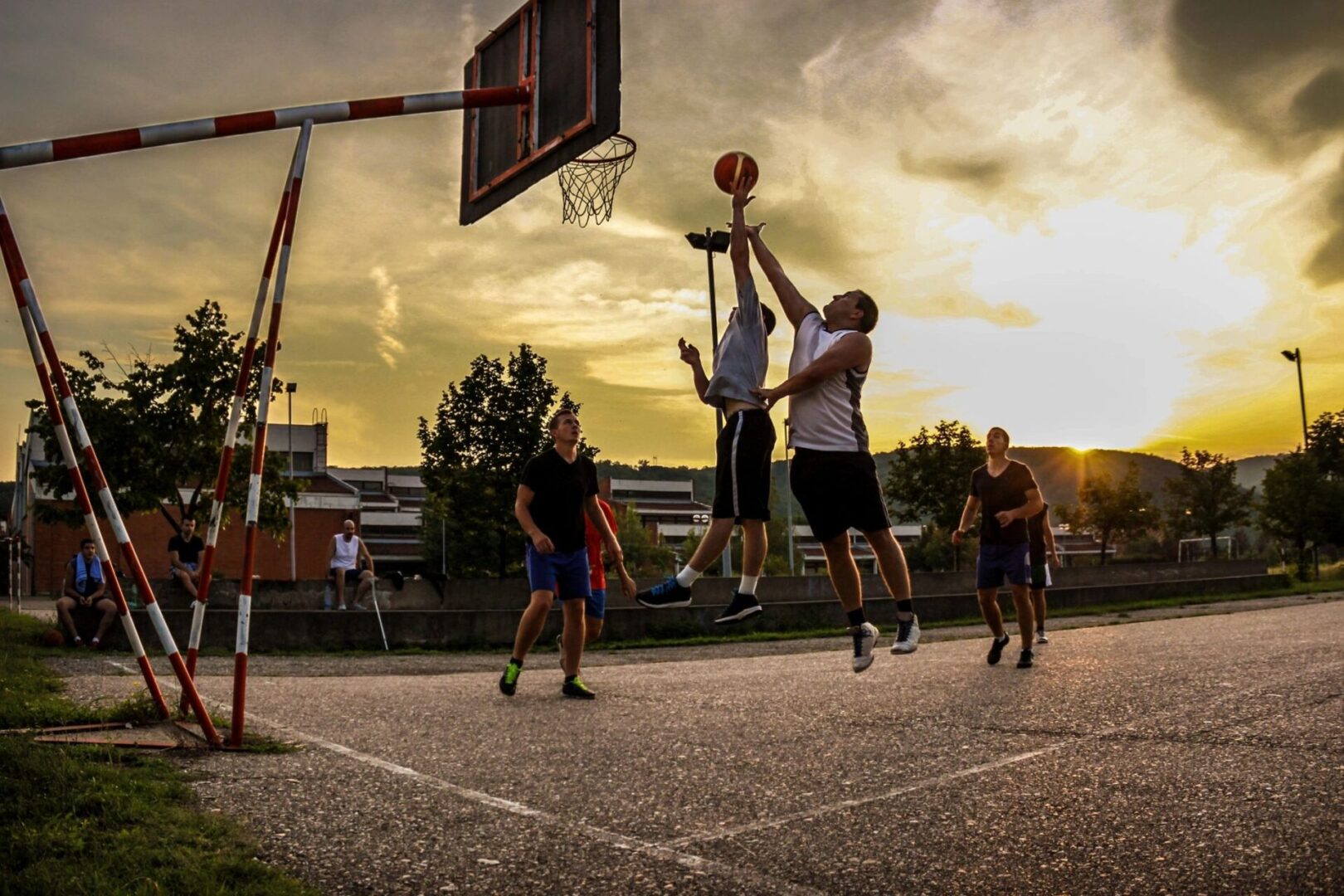 a group of boys playing basketball